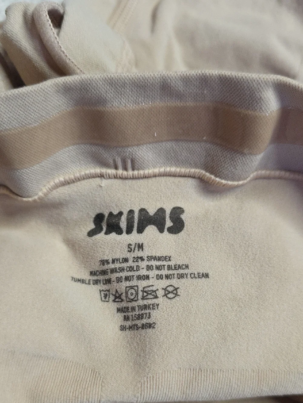 SKIMS reposhing these